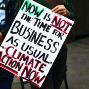 Demoplakat: Now is not the time for business as usual. Climate Action now.